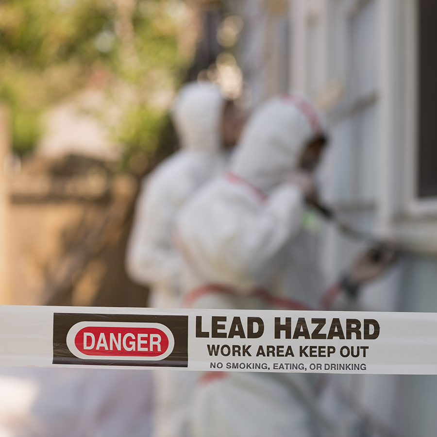 Workers in Hazmat Suits Getting Rid Of Lead Paint in a Local Home.